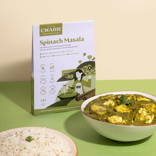 Box of Charr Spinach Masala with a bowl of spinach masala and rice on a green background